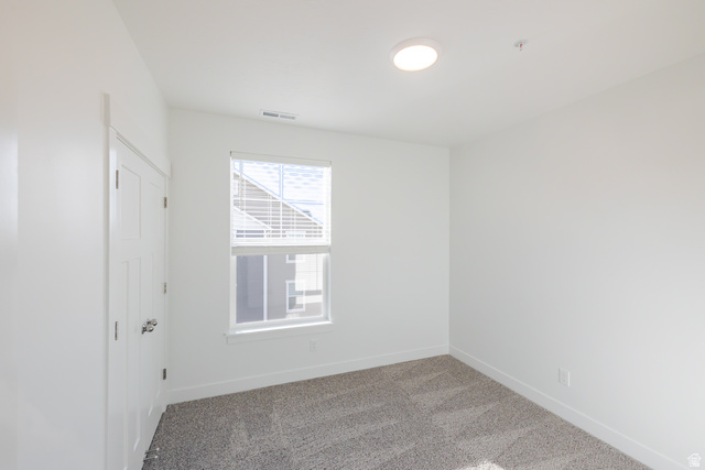 4662 Poplar Way, Unit Q301 Mapleton, UT 84664 - Photo 13 of 18 Empty room featuring baseboards and light colored carpet