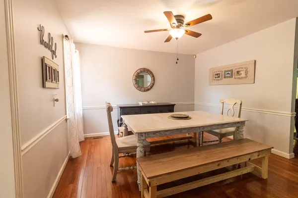 a work room with furniture and a flat screen tv