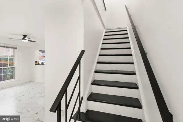 a bedroom with bed and window