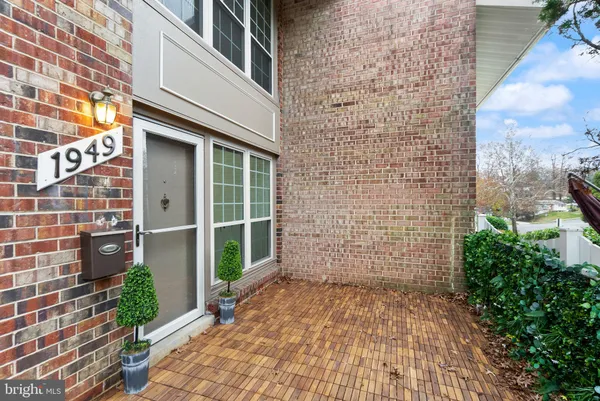 a view of a brick house with a large window