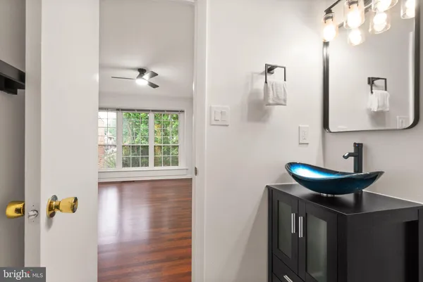 a white toilet sitting next to a bathroom sink