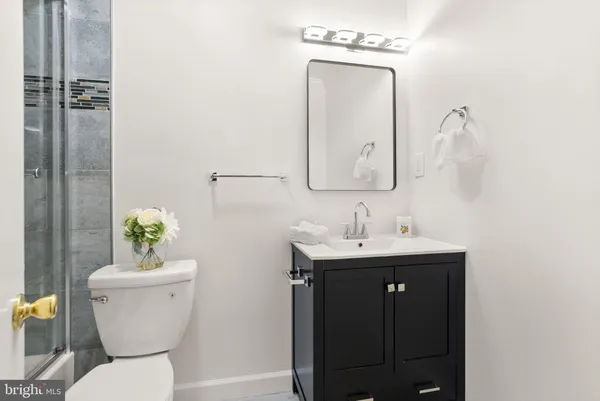 a bathroom with a shower and a toilet