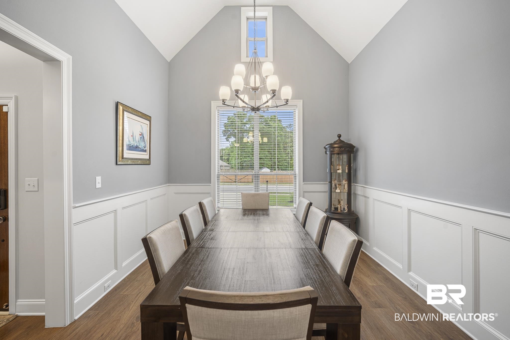 12672 Squirrel Drive Daphne, AL 36527 - Photo 5 of 49 Dining area featuring vaulted ceilings, wood-finish flooring, and wainscoting