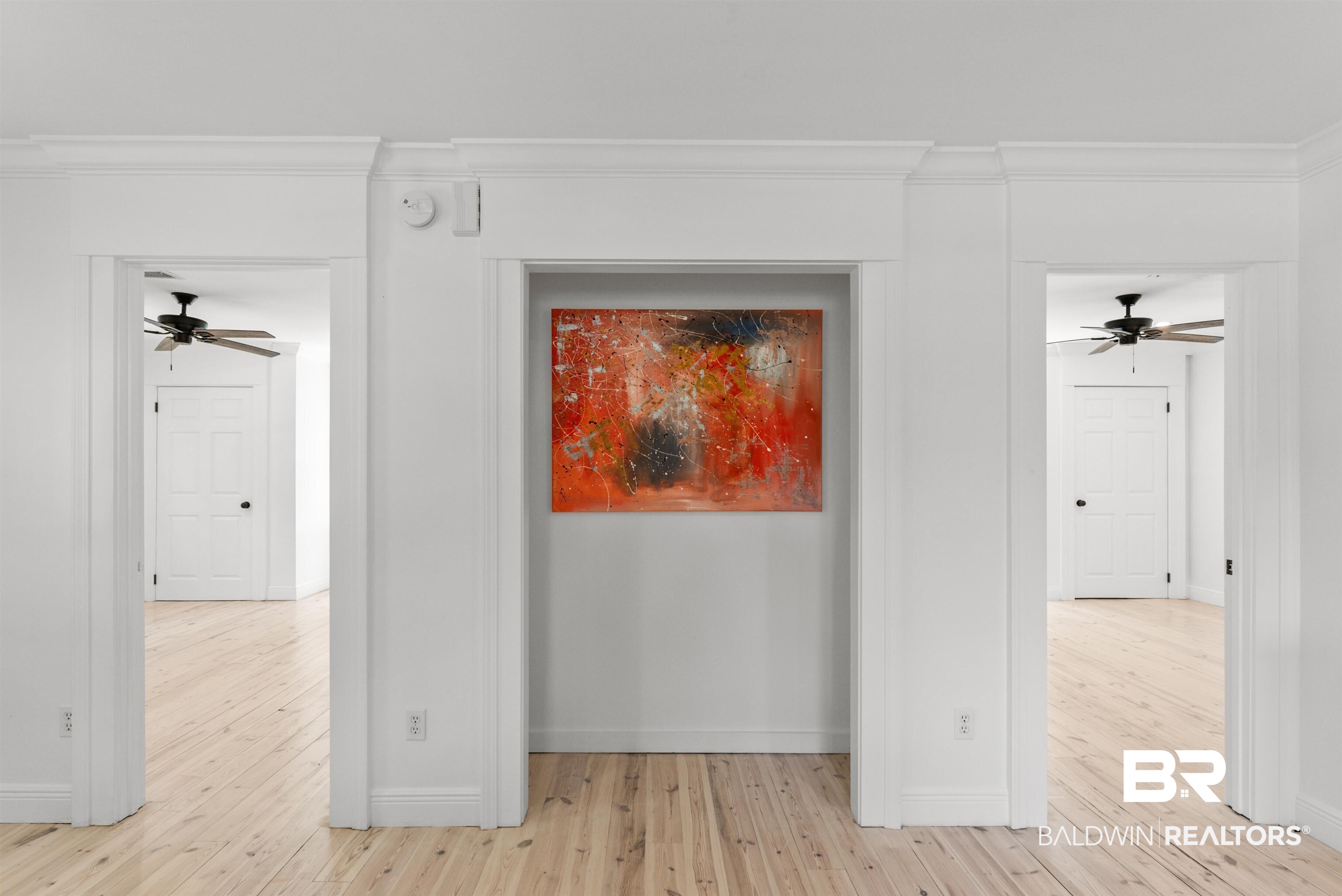 6447 Bemis Lane Bon Secour, AL 36511 - Photo 22 of 62 White interior walls featuring decorative crown molding and baseboards