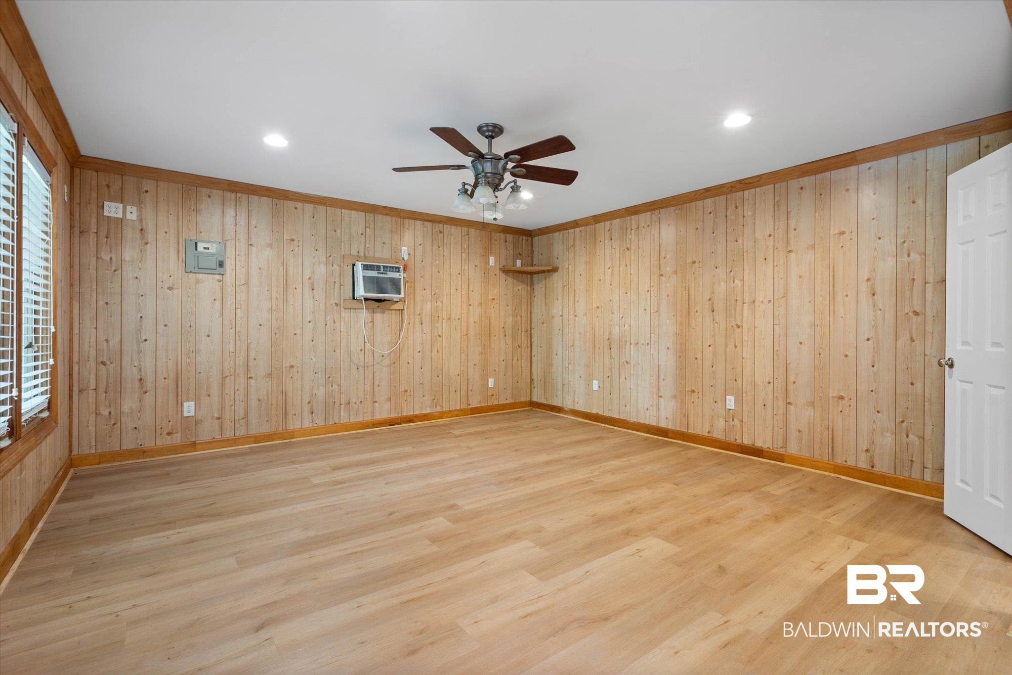 3715 Latigo Road Mobile, AL 36695 - Photo 22 of 39 Spare room with a ceiling fan, wood finished floors, wooden walls, recessed lighting, and baseboards