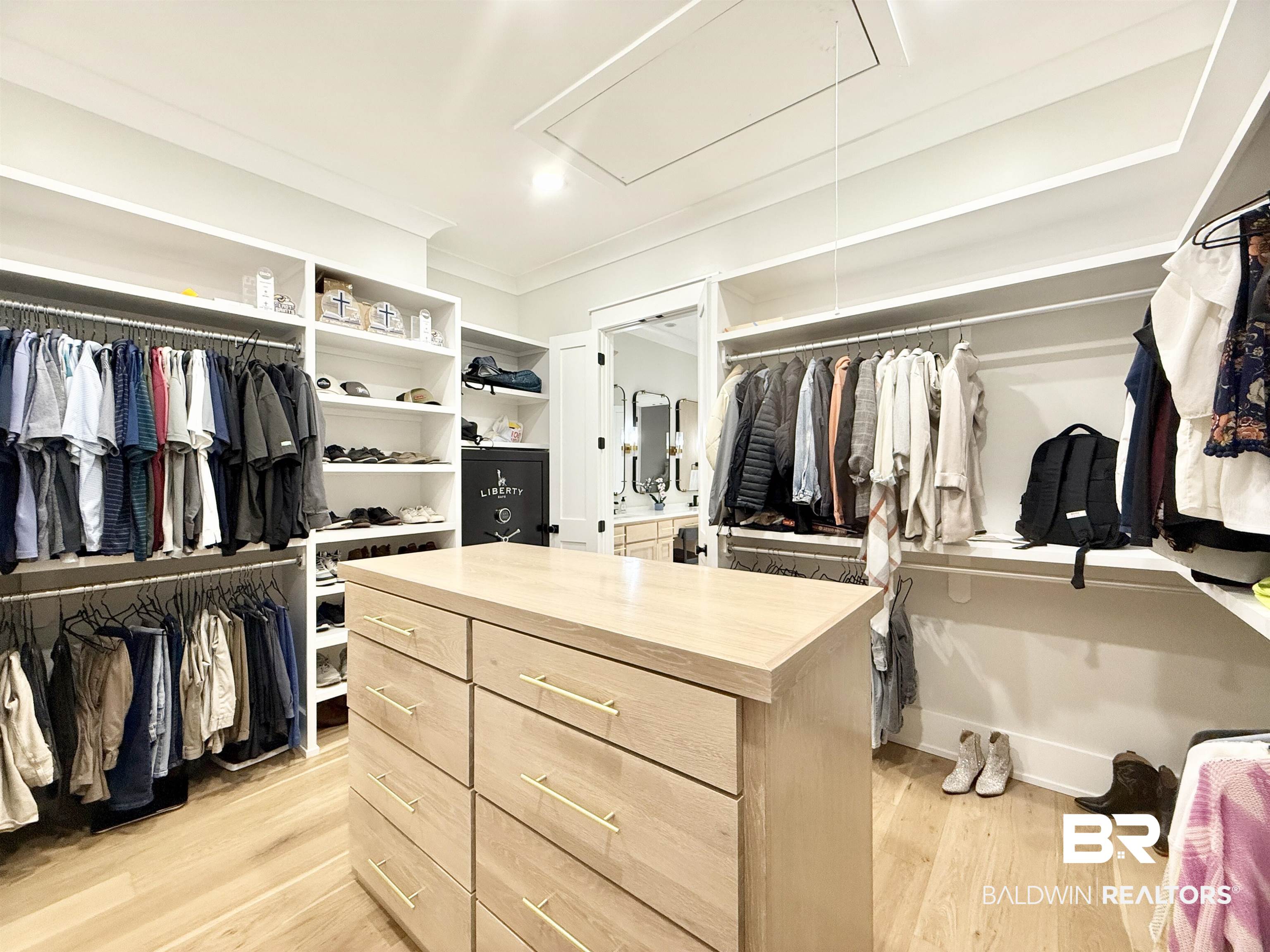 21767 Gallery Boulevard Fairhope, AL 36532 - Photo 38 of 74 Walk in closet with attic access and light wood-style flooring