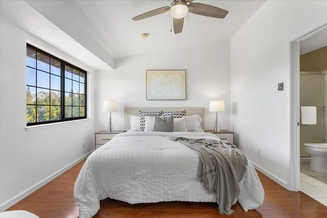 a bedroom with a bed and a window