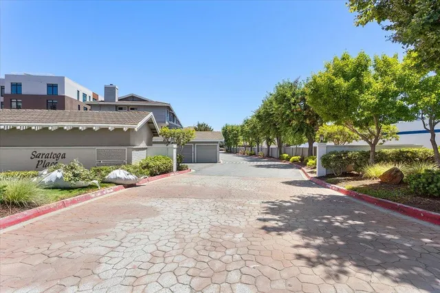 a view of a house with a yard and plants