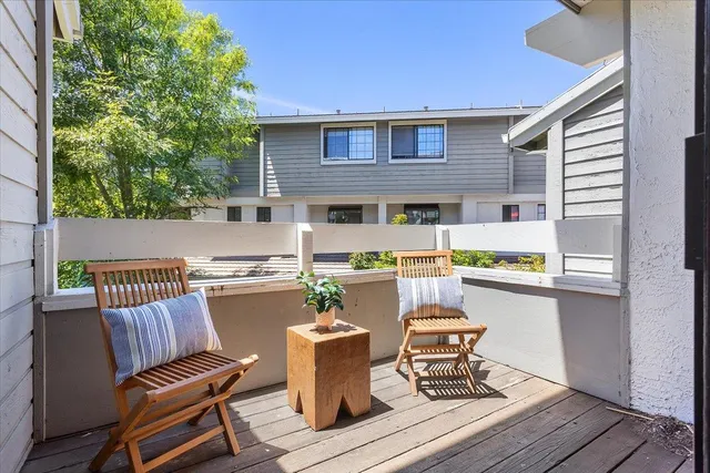 a view of a chairs and table on the deck