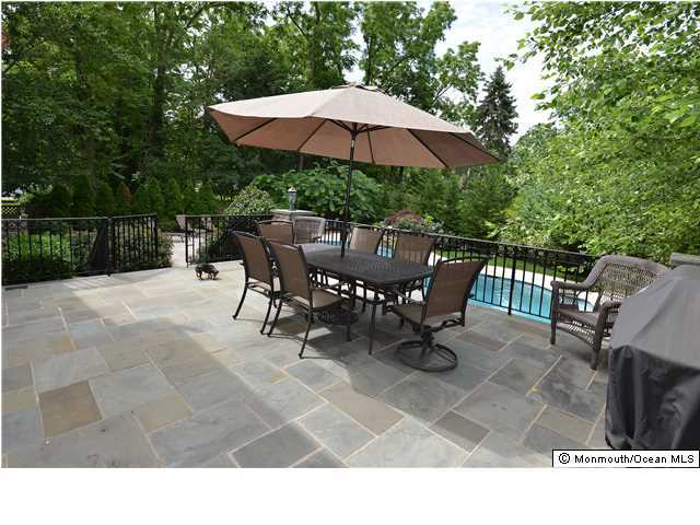 18 Rustic Terrace Little Silver, NJ 07739 - Photo 3 of 3 a backyard of a house with table and chairs