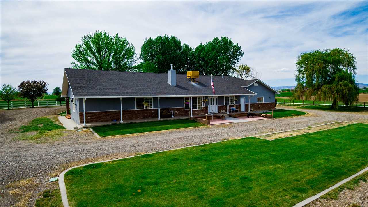 1640 12 Road Loma, CO 81524 - Photo 28 of 36 a front view of a house with a yard