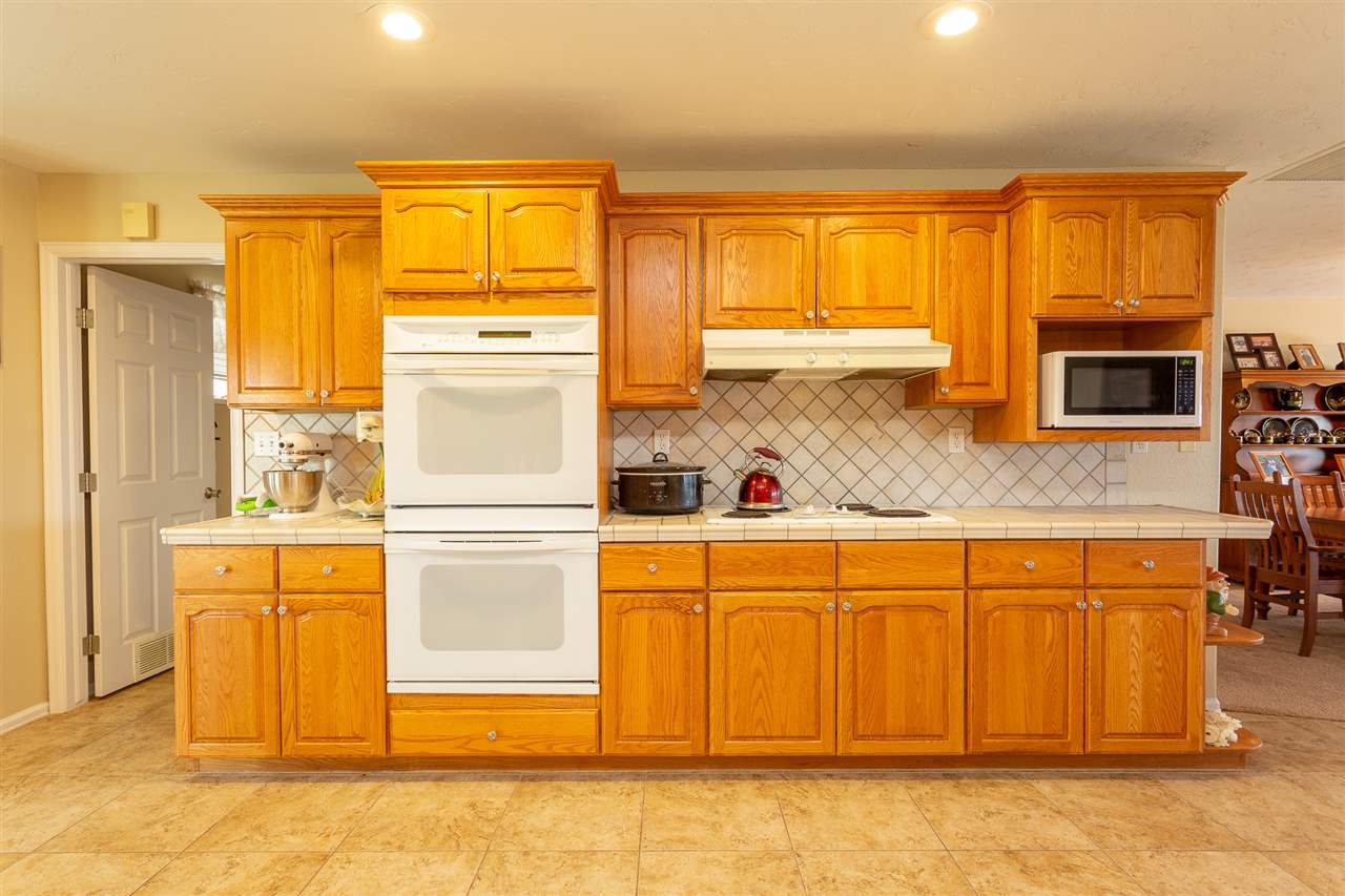 1640 12 Road Loma, CO 81524 - Photo 5 of 36 a kitchen with stainless steel appliances a refrigerator and cabinets
