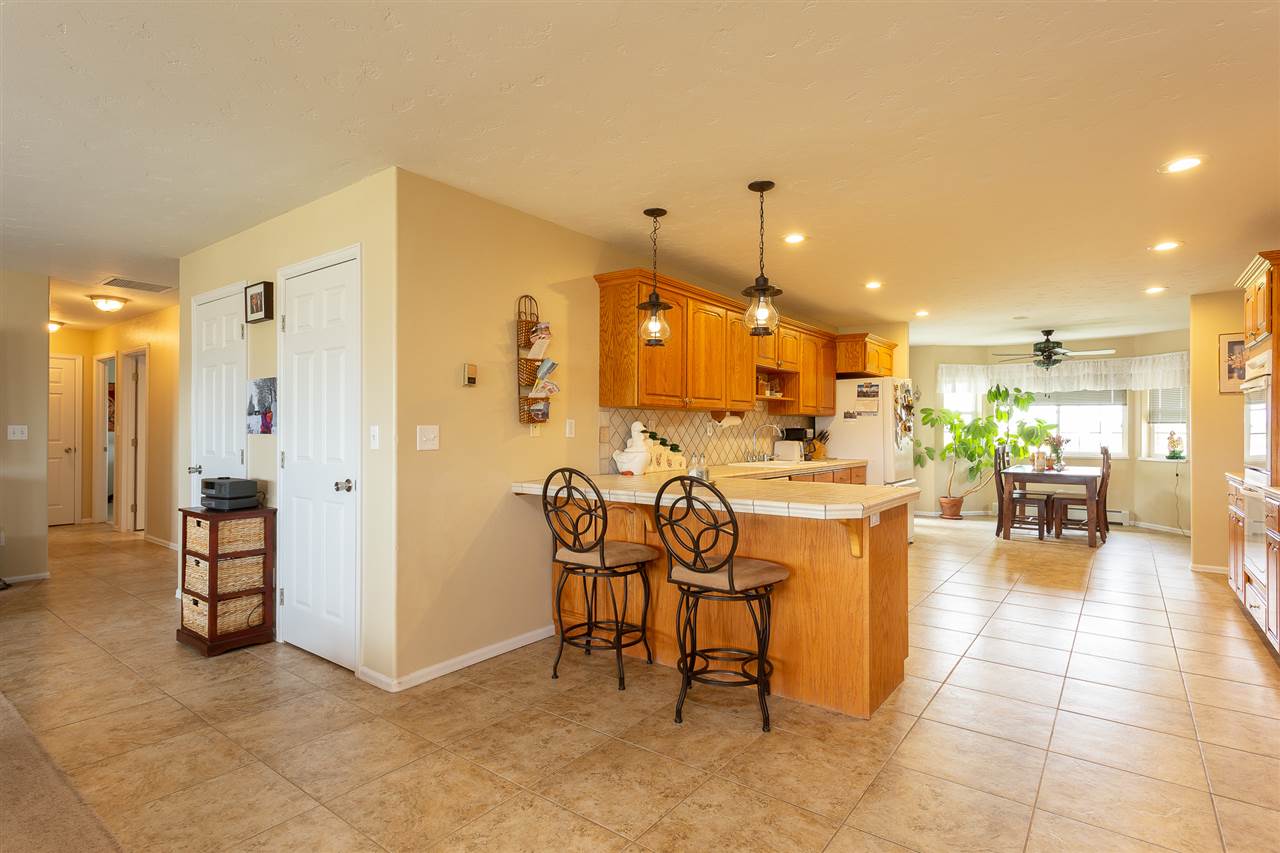 1640 12 Road Loma, CO 81524 - Photo 7 of 36 a room with lots of furniture and a view of dining room
