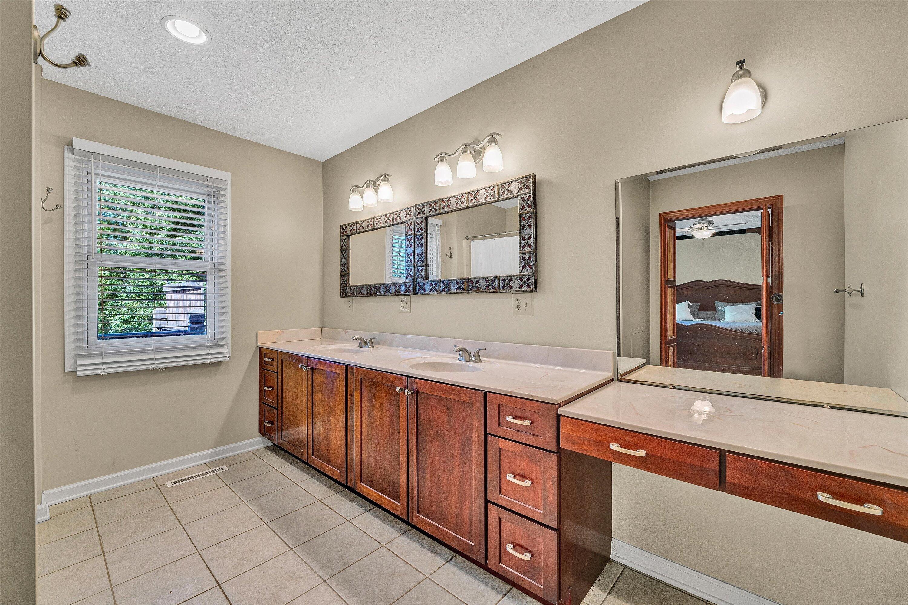 400 Harbor Moneta, VA 24121 - Photo 22 of 51 a spacious bathroom with a granite countertop sink and a mirror