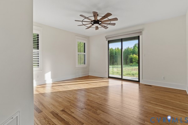 10512 River Road Chesterfield, VA 23838 - Photo 43 of 64 Hardwood flooring, white walls, two windows with p