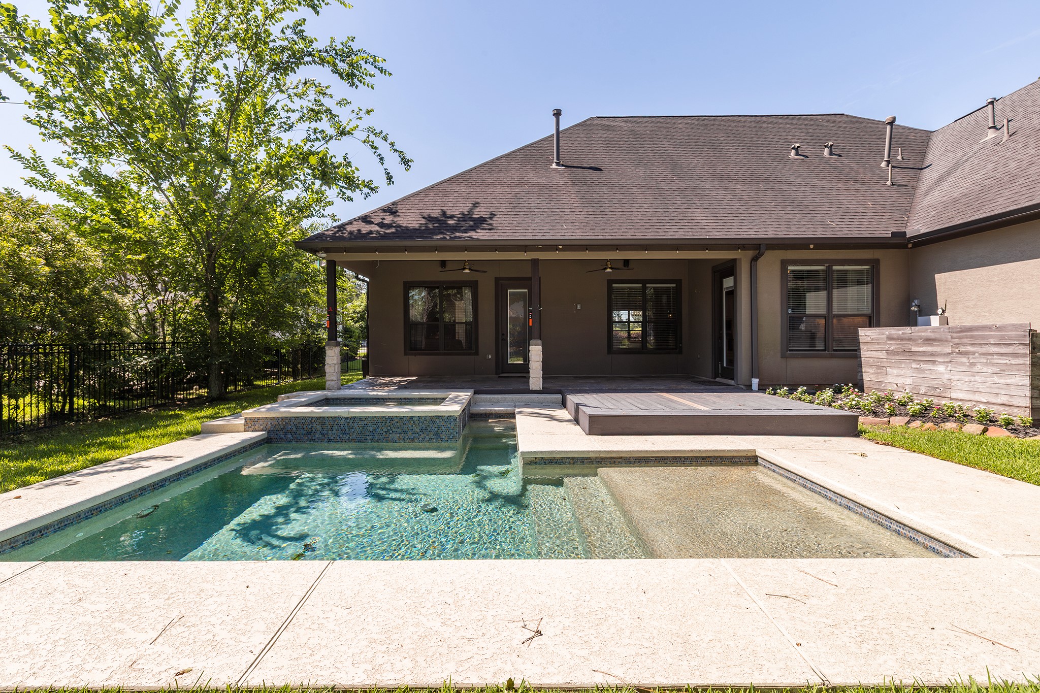 5507 Bright Timber Landing Drive Spring, TX 77386 - Photo 4 of 45 Beautifully sized pool with tanning ledge and hot tub!