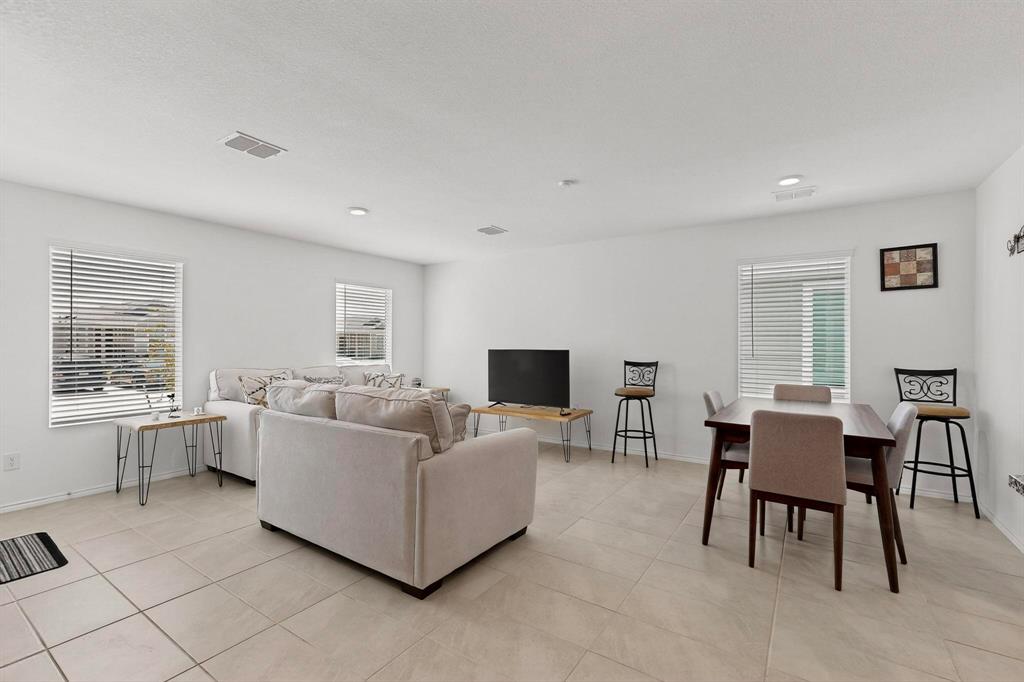 154 Herman Lane Princeton, TX 75407 - Photo 11 of 37 a living room with furniture and a flat screen tv