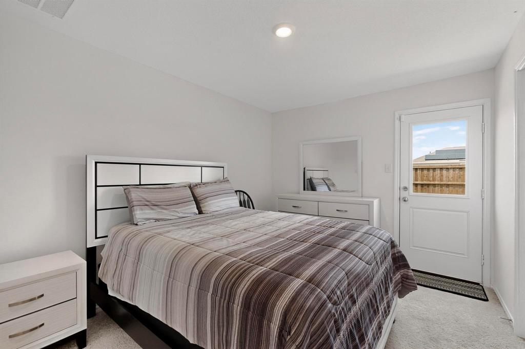154 Herman Lane Princeton, TX 75407 - Photo 13 of 37 a bedroom with a bed and window