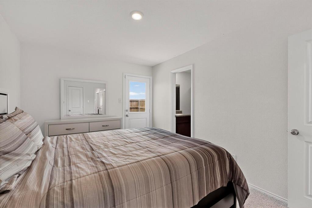 154 Herman Lane Princeton, TX 75407 - Photo 14 of 37 a bedroom with a bed and closet