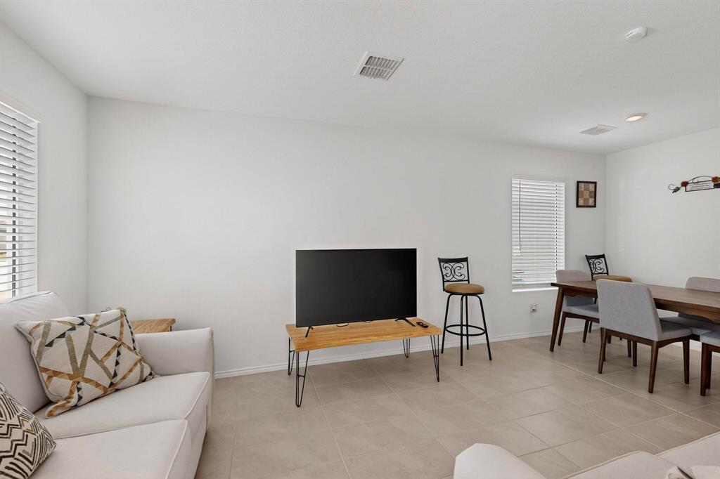154 Herman Lane Princeton, TX 75407 - Photo 2 of 37 a living room with furniture and a flat screen tv