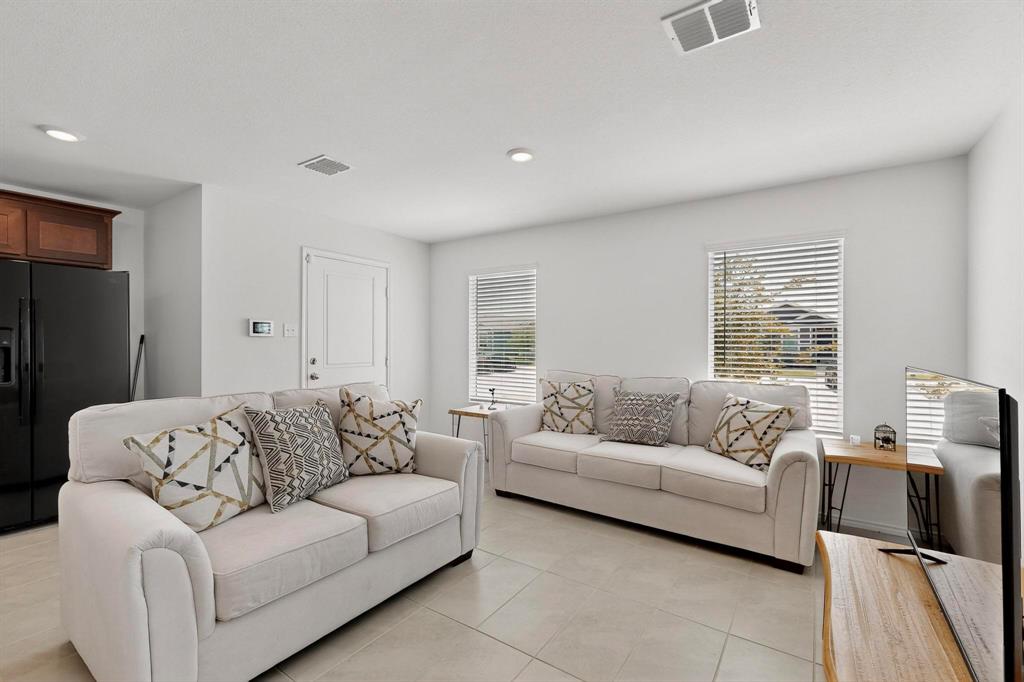 154 Herman Lane Princeton, TX 75407 - Photo 3 of 37 a living room with furniture and a large window