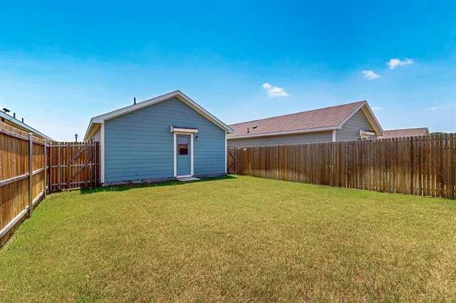 a view of an empty room with basketball court