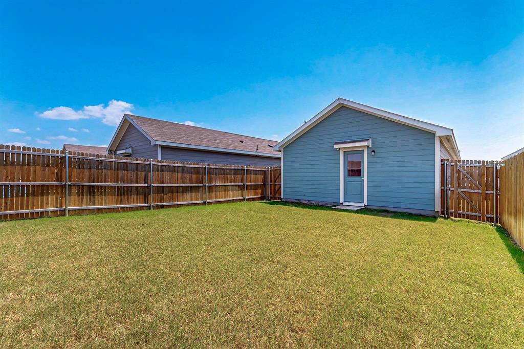 154 Herman Lane Princeton, TX 75407 - Photo 31 of 37 a front view of a house with a garden