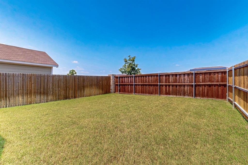 154 Herman Lane Princeton, TX 75407 - Photo 36 of 37 a view of backyard and wooden fence