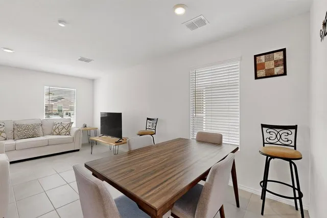 a kitchen with stainless steel appliances granite countertop a refrigerator stove and sink