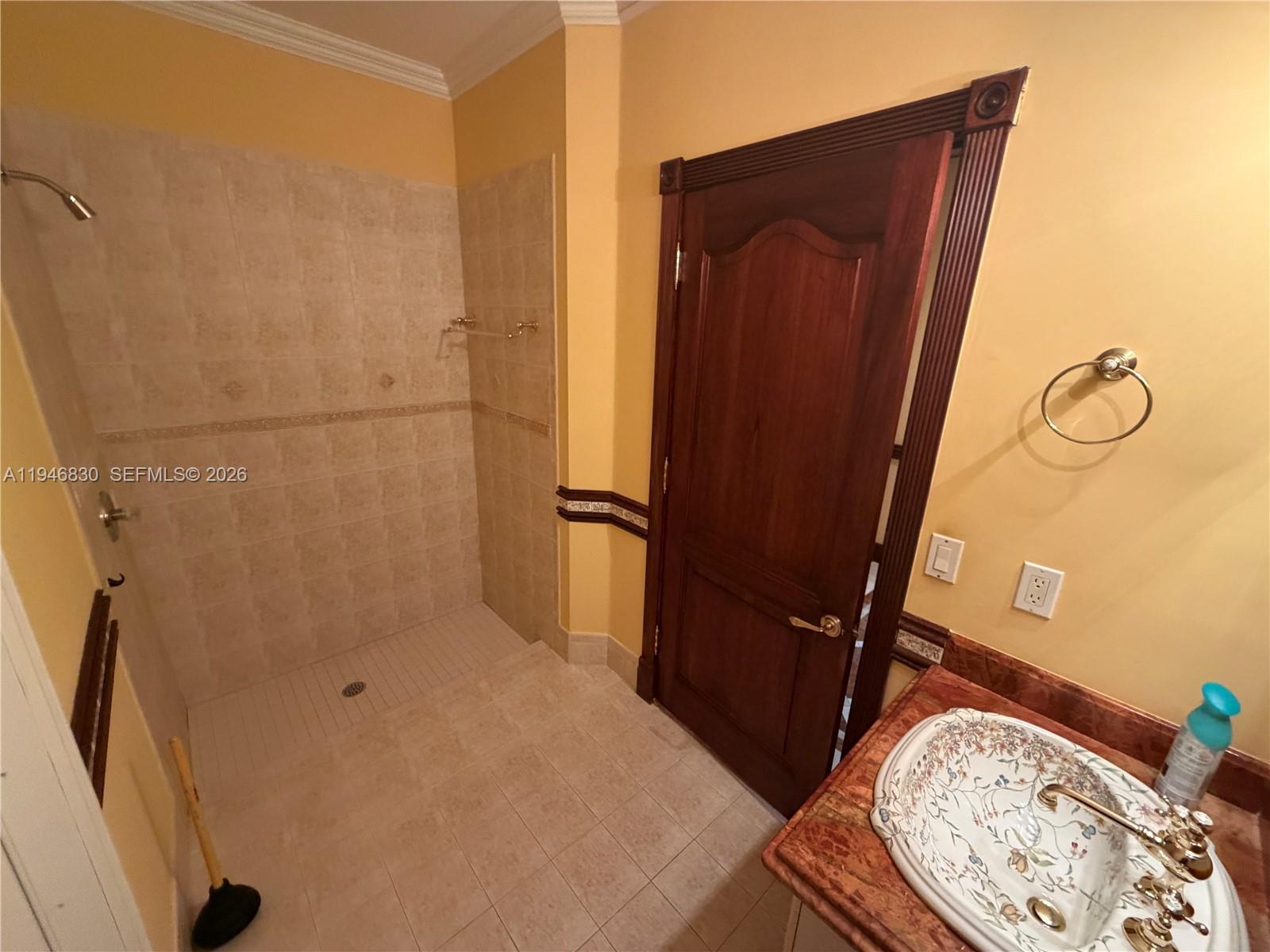 6601 Southwest 166th Court Miami, FL 33193 - Photo 15 of 28 a bathroom with a sink and a mirror