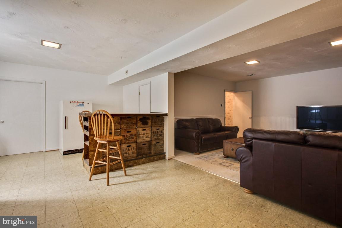 12314 Purcell Road Manassas, VA 20112 - Photo 22 of 35 Large basement with recessed lighting and wet bar