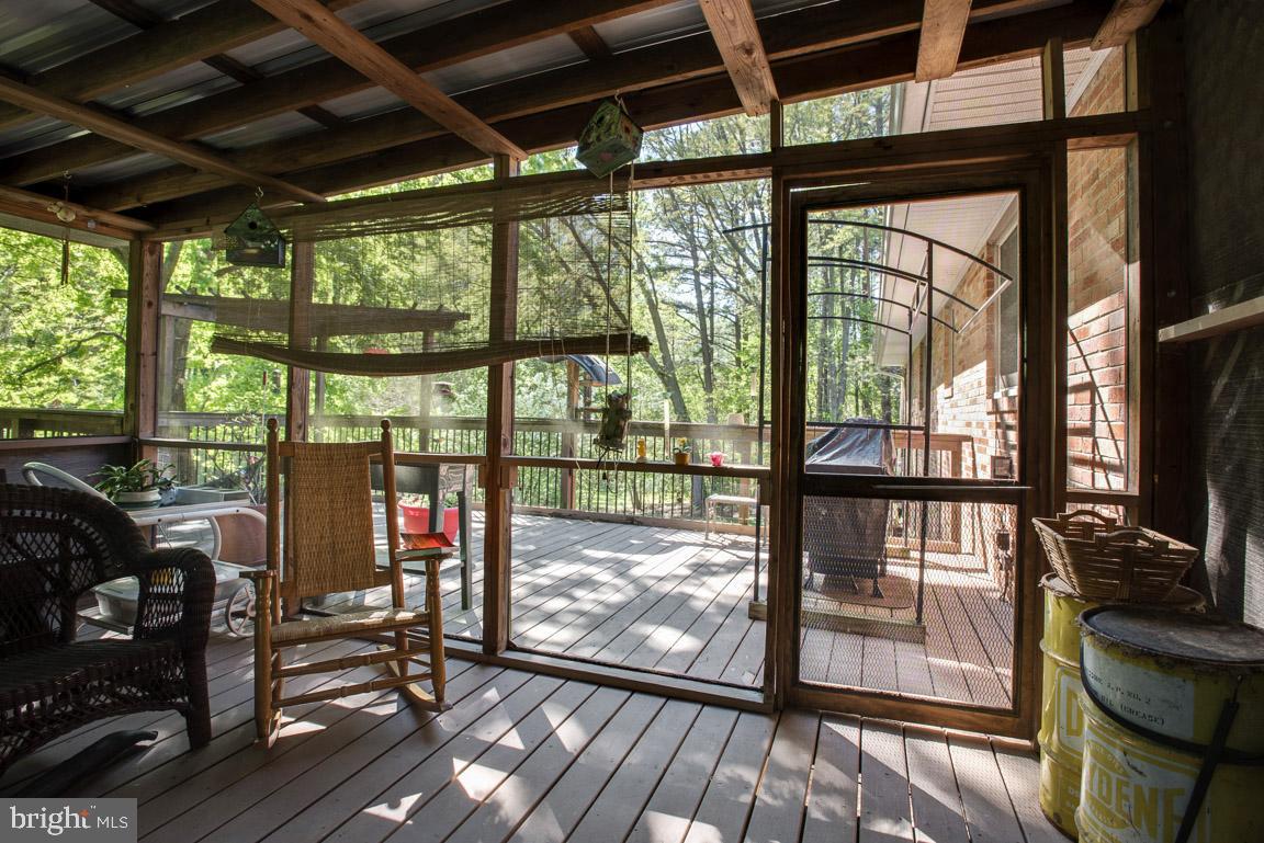 12314 Purcell Road Manassas, VA 20112 - Photo 28 of 35 Large screened in porch and extended deck