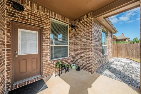 a brick house with a large windows