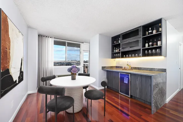 a view of a dining room with furniture and window