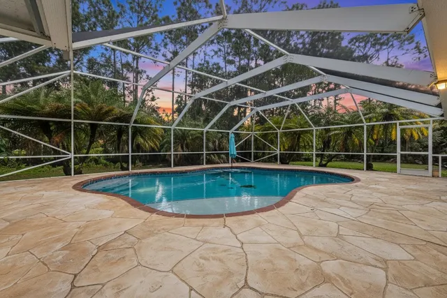 a view of a backyard with a wooden fence