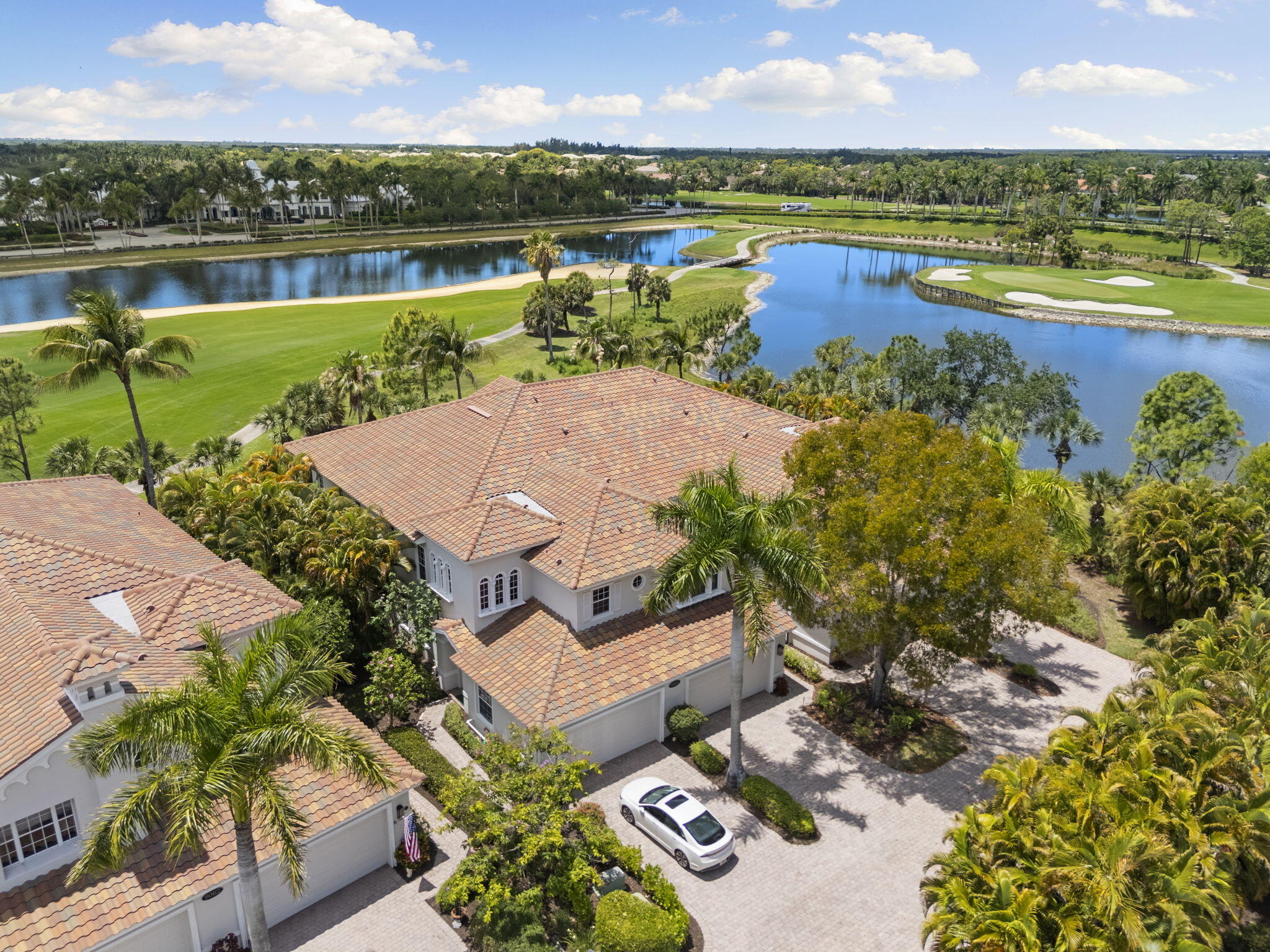 an aerial view of a house with a swimming pool outdoor seating and yard
