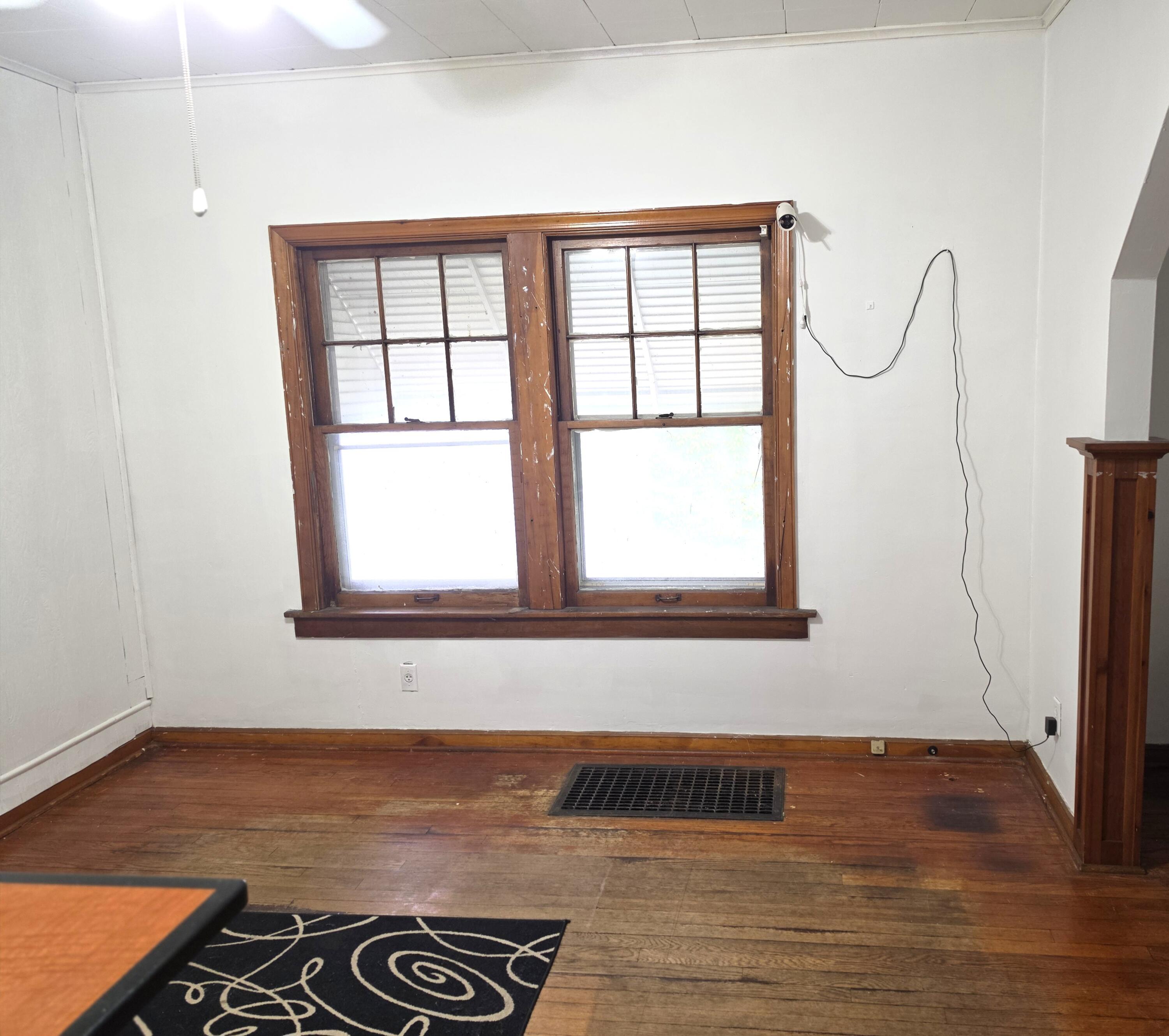 1173 Tyler Street Gary, IN 46407 - Photo 11 of 36 a view of empty room with wooden floor and fan