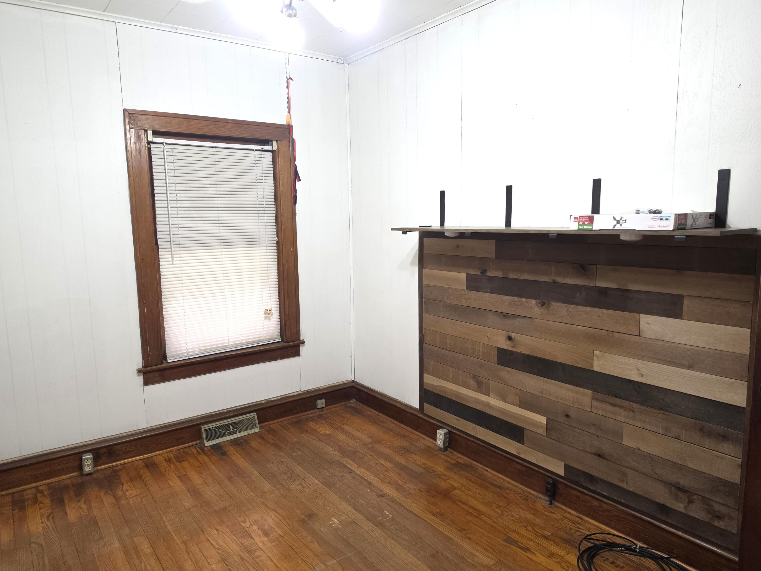 1173 Tyler Street Gary, IN 46407 - Photo 16 of 36 a view of a room with wooden floor