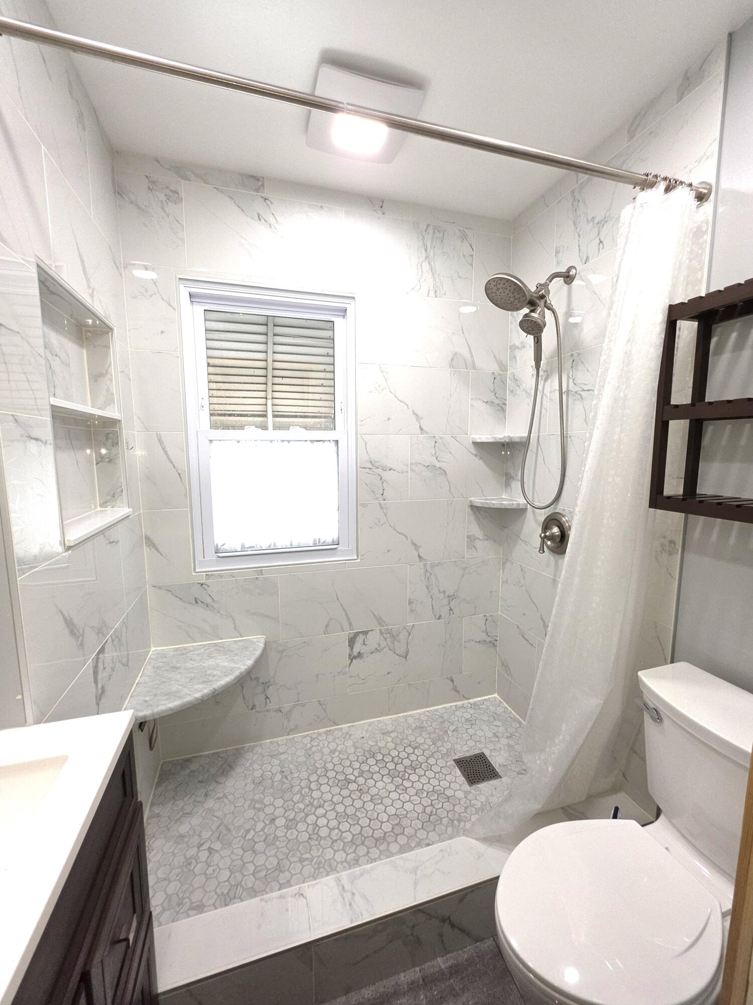1173 Tyler Street Gary, IN 46407 - Photo 19 of 36 a bathroom with a granite countertop sink a toilet and shower