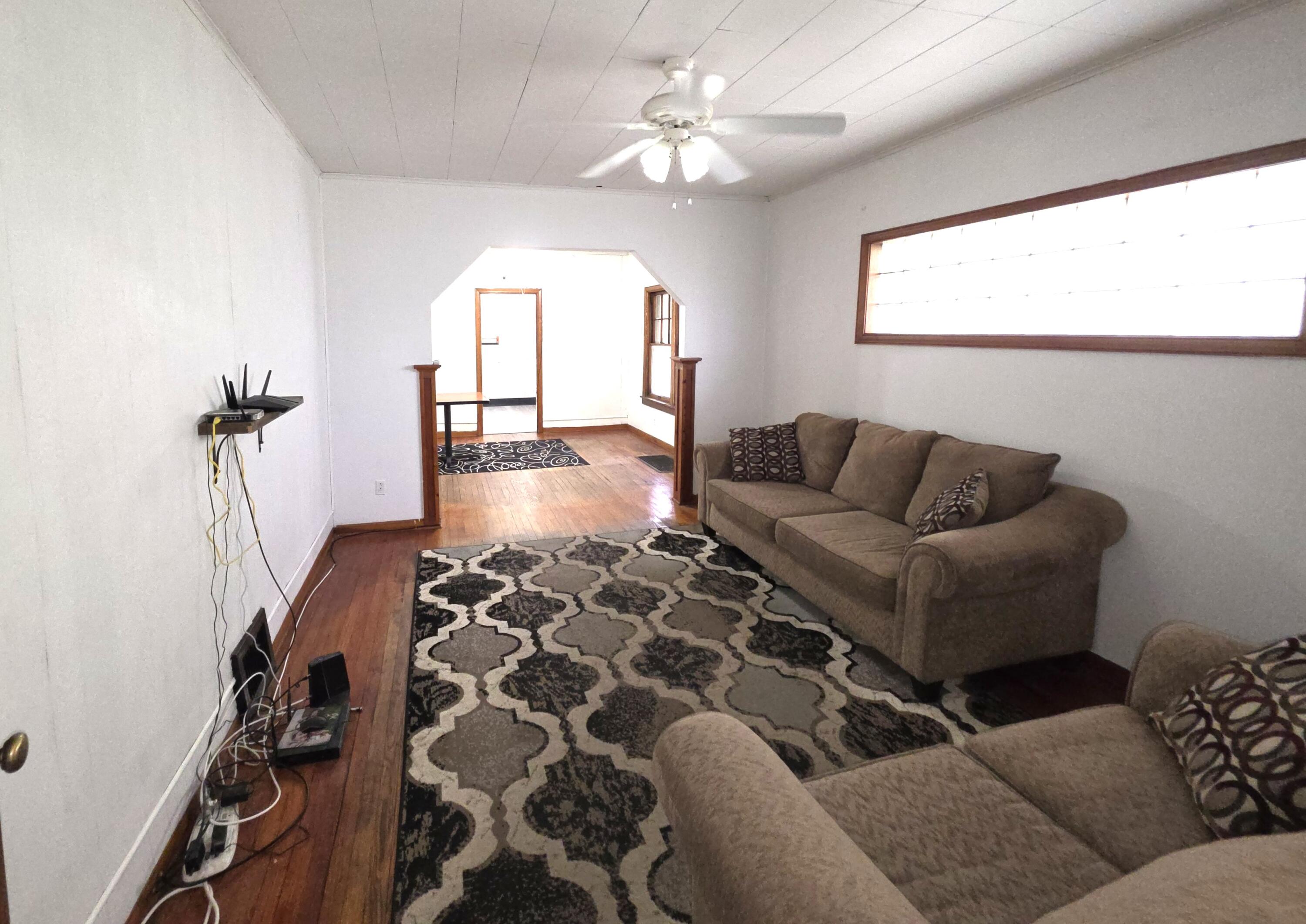 1173 Tyler Street Gary, IN 46407 - Photo 6 of 36 a living room with furniture and a flat screen tv