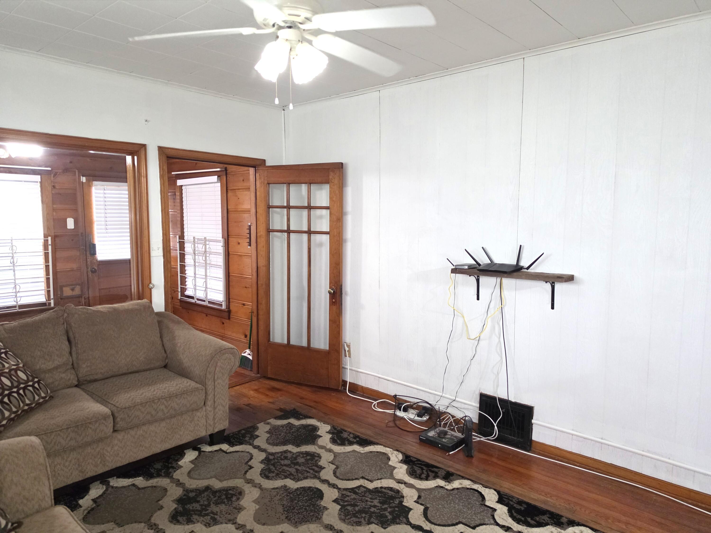1173 Tyler Street Gary, IN 46407 - Photo 8 of 36 a living room with furniture and a window