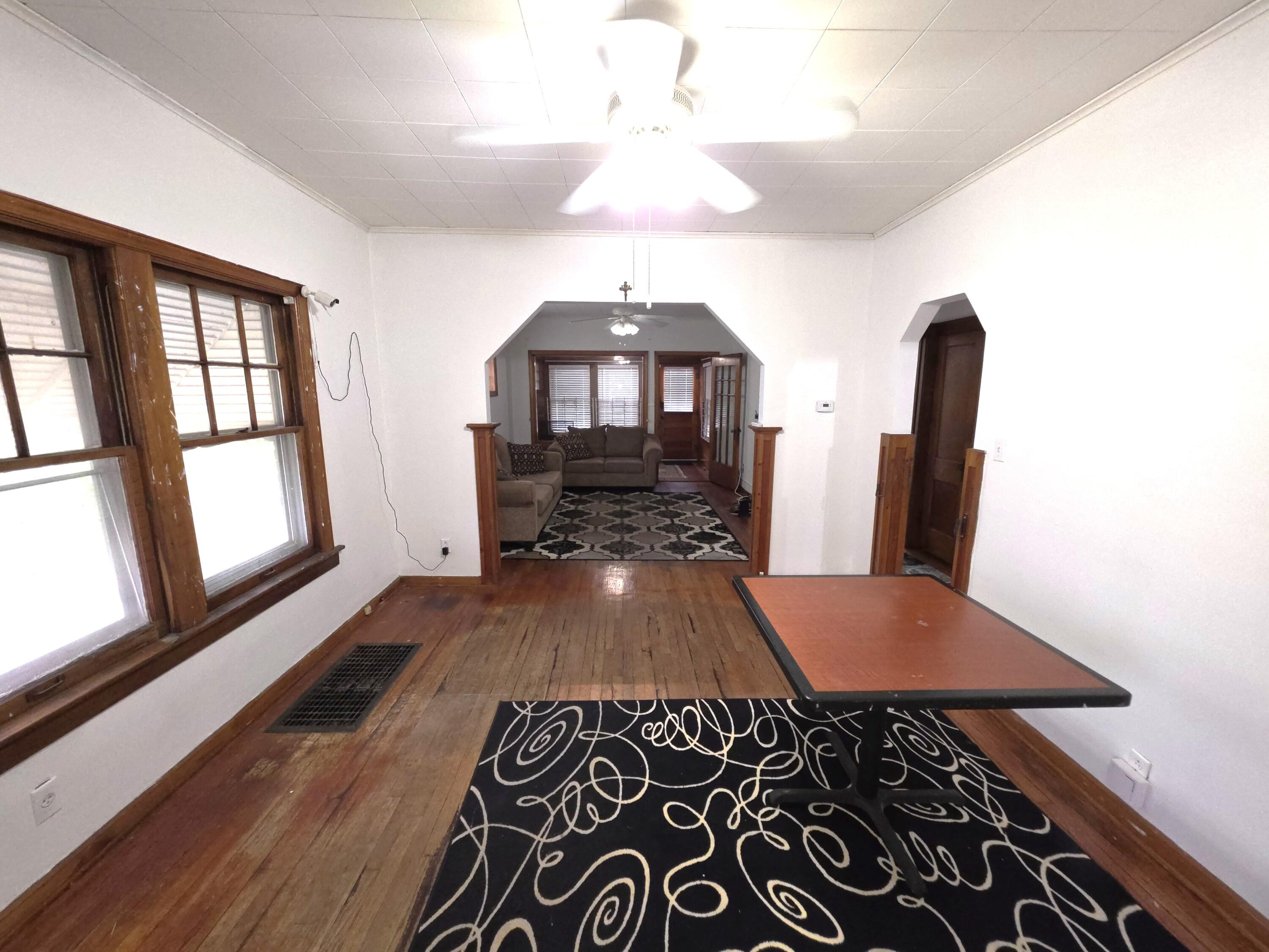 1173 Tyler Street Gary, IN 46407 - Photo 10 of 36 a view of a hallway with furniture and wooden floor