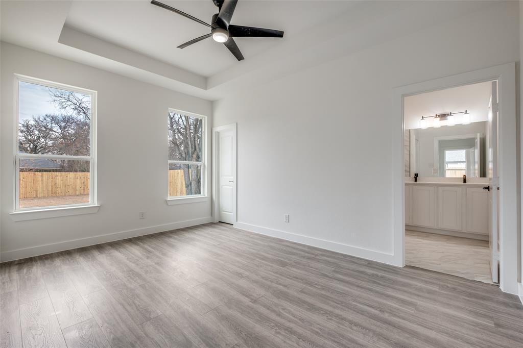 4812 Fellows Lane Dallas, TX 75216 - Photo 16 of 25 wooden floor in an empty room with a window