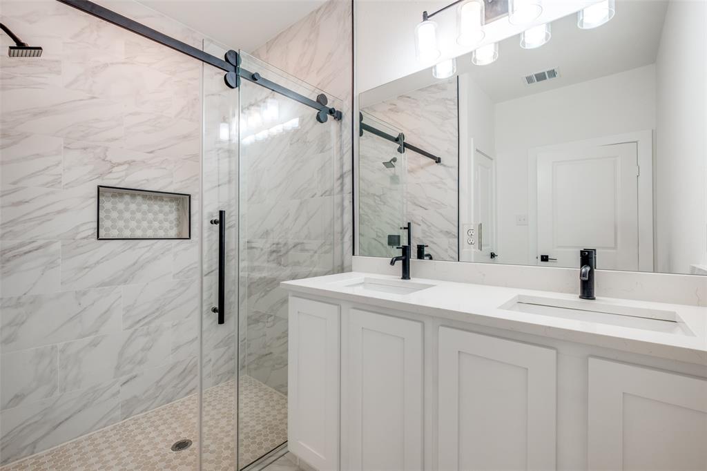 4812 Fellows Lane Dallas, TX 75216 - Photo 18 of 25 a bathroom with a sink and a mirror
