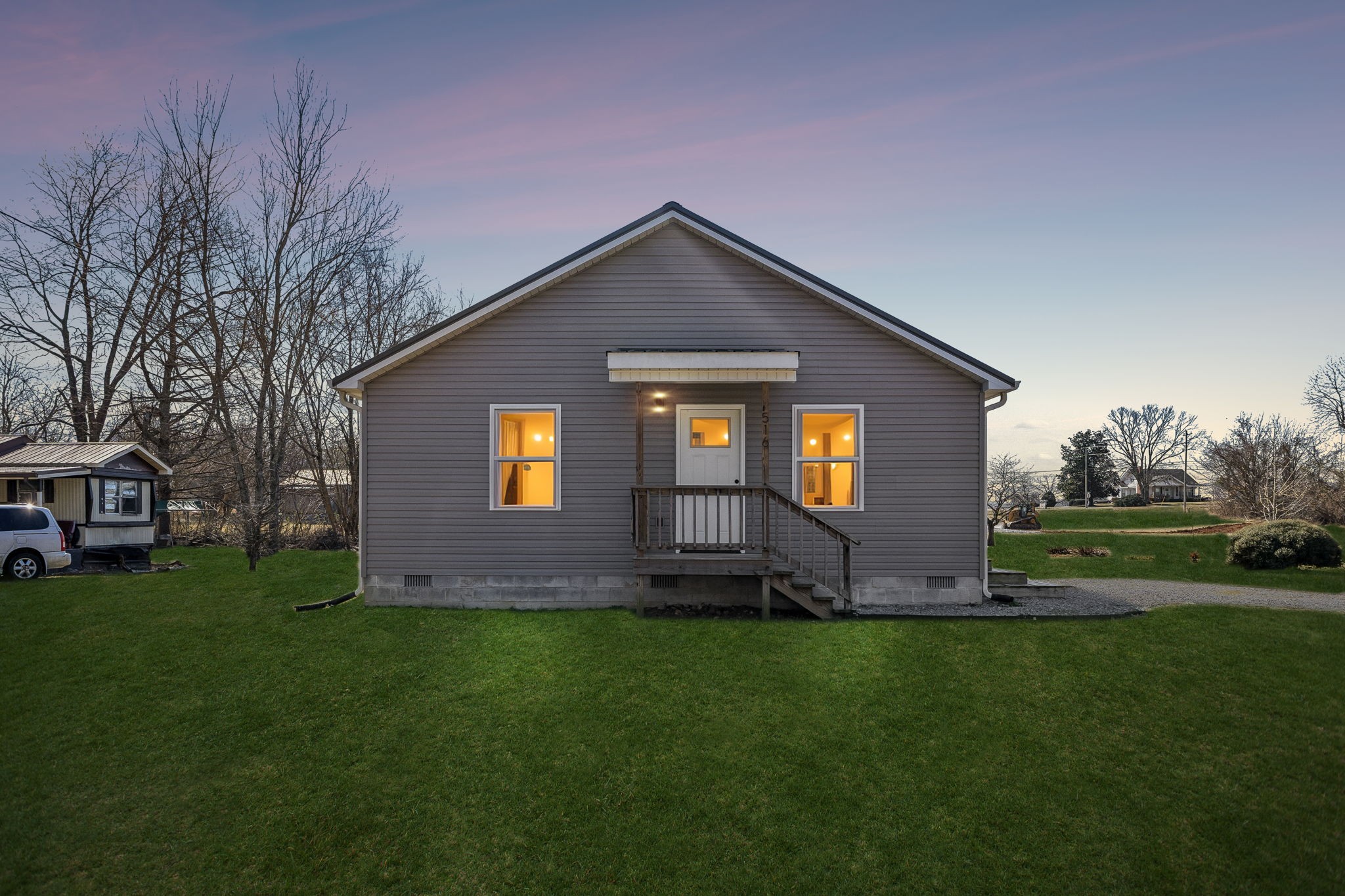 a view of a house with a yard