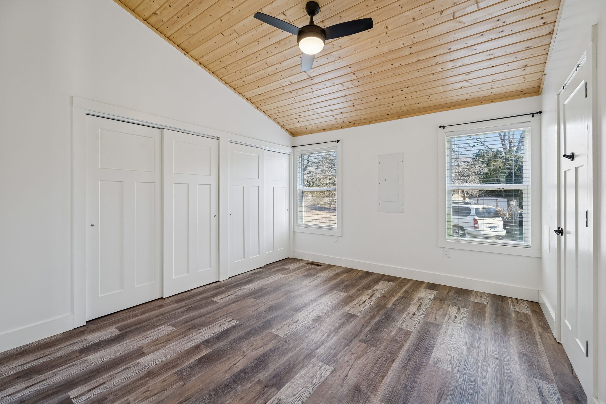 516 Davis Street Cowan, TN 37318 - Photo 21 of 40 a view of an empty room with wooden floor and a window