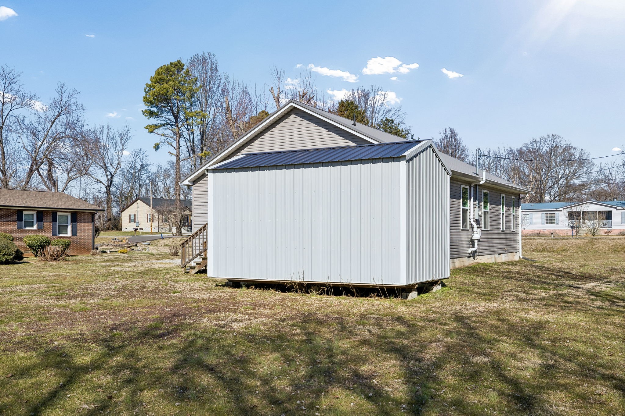 516 Davis Street Cowan, TN 37318 - Photo 26 of 40 a view of a house with a yard