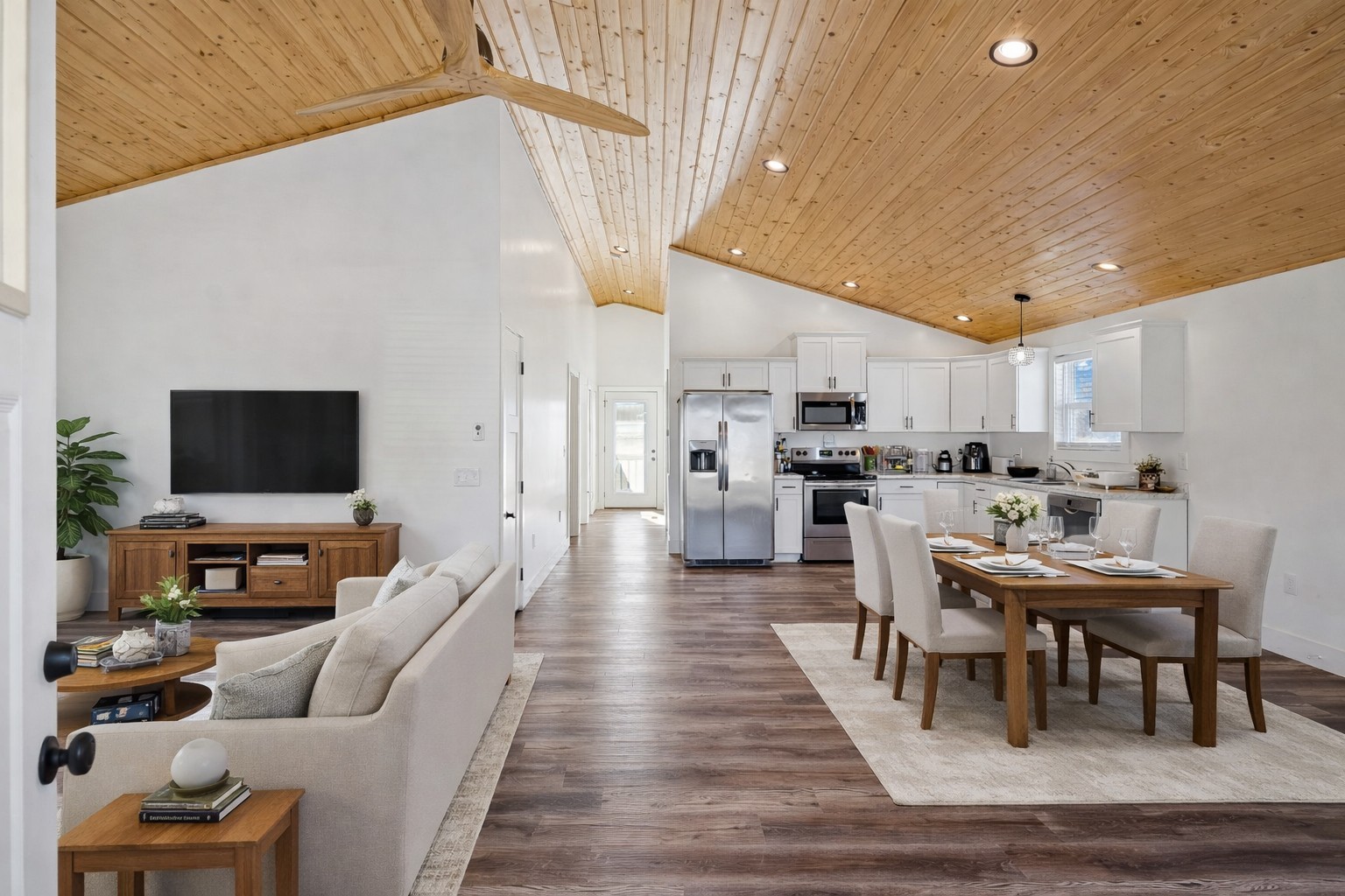 516 Davis Street Cowan, TN 37318 - Photo 3 of 40 a living room with stainless steel appliances furniture a flat screen tv and kitchen view