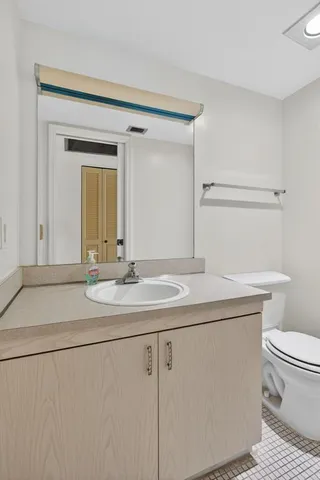 a view of an empty room and closet area