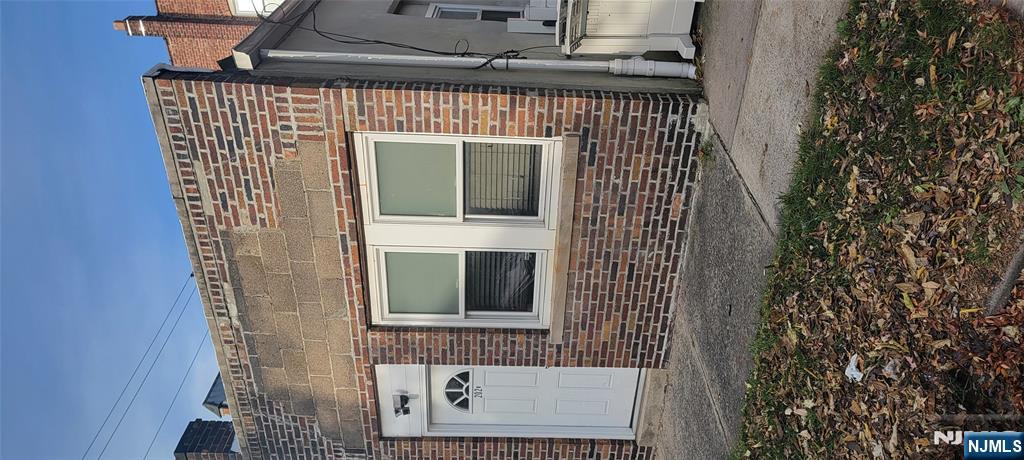 196 Fort Lee Road Teaneck, NJ 07666 - Photo 12 of 13 a front view of a house with a yard